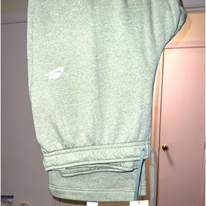 Light green Nike sweatpants.